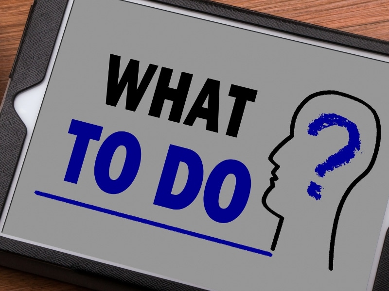 Tablet showing text WHAT TO DO for before and after teeth restoration planning.